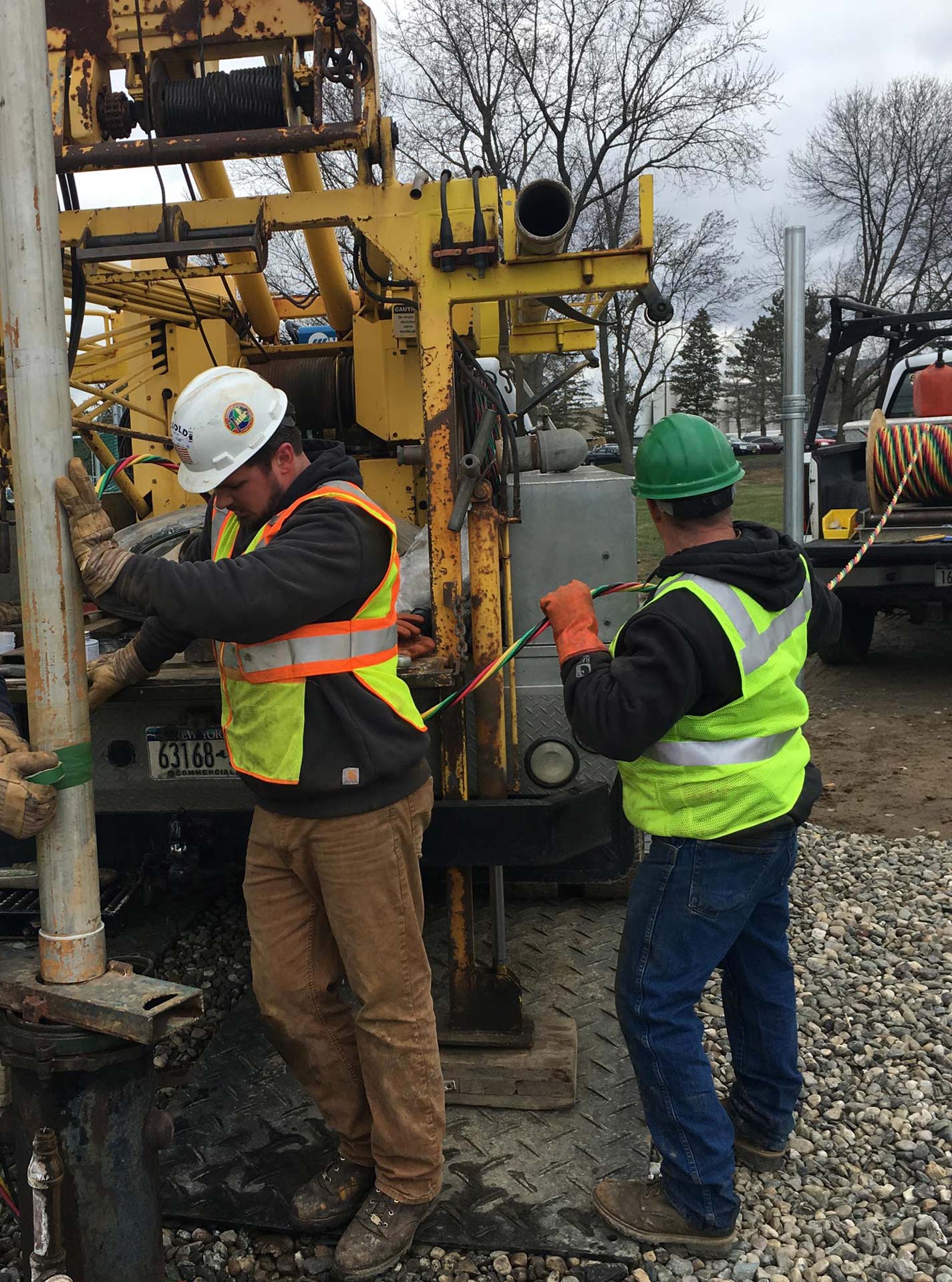 Workers from Goold Wells & Pumps drilling a well
