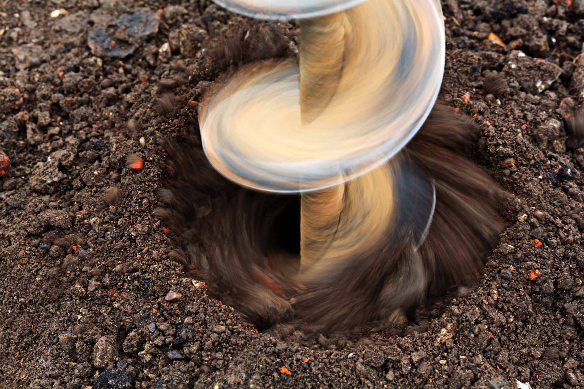 Close up action shot of a well being drilled