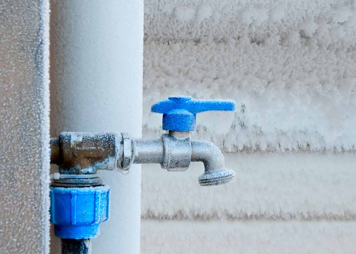 Outdoor water tap covered in heavy frost